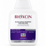 شامبو Bioxcin بالثوم الأسود ضد التساقط وترقق الشعر – 300 مل